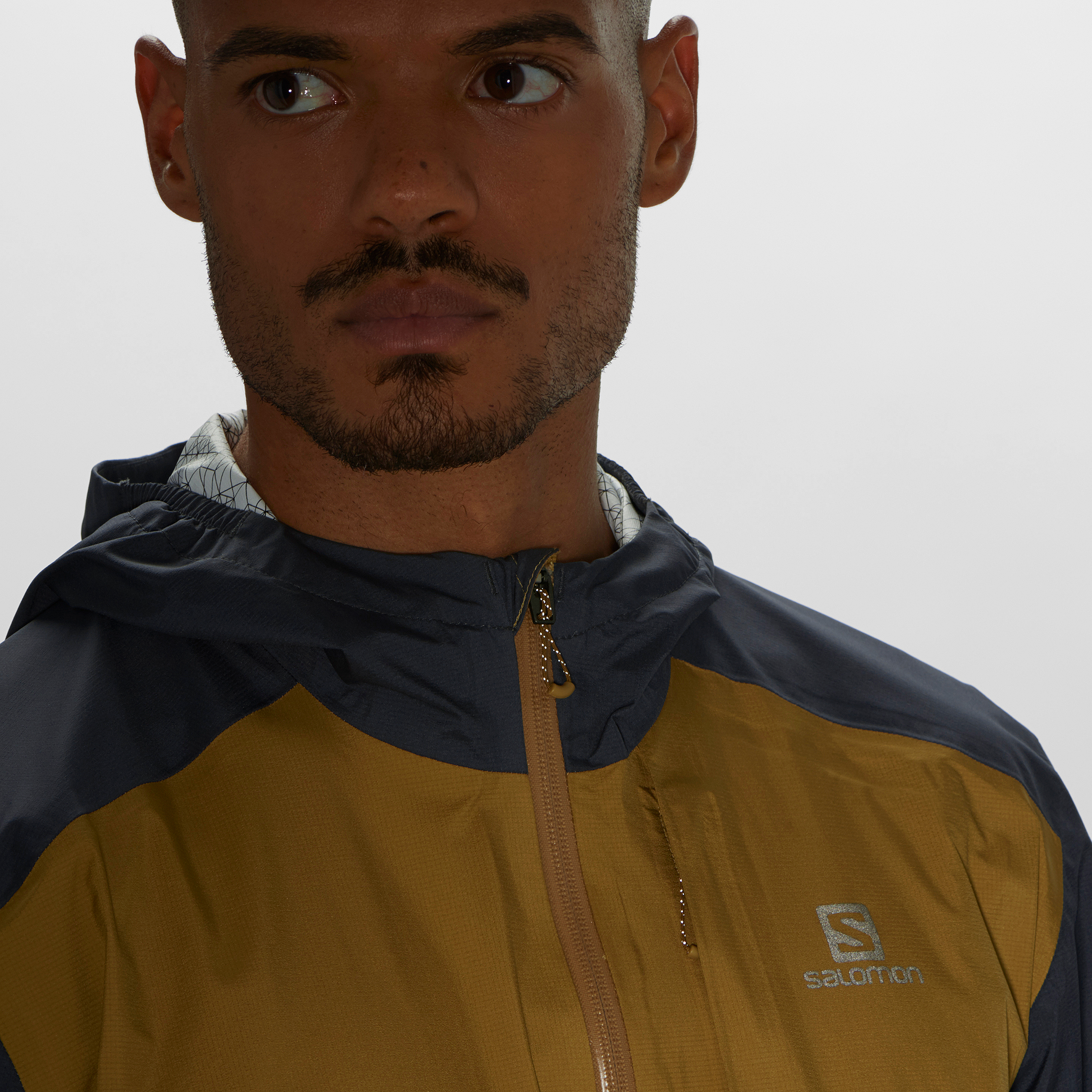 LC1639200_5_MOD_bonatti25ljkt_cuminebony_pullerreflective_m Salomon Bonatti Jacket M Meudon Running Company